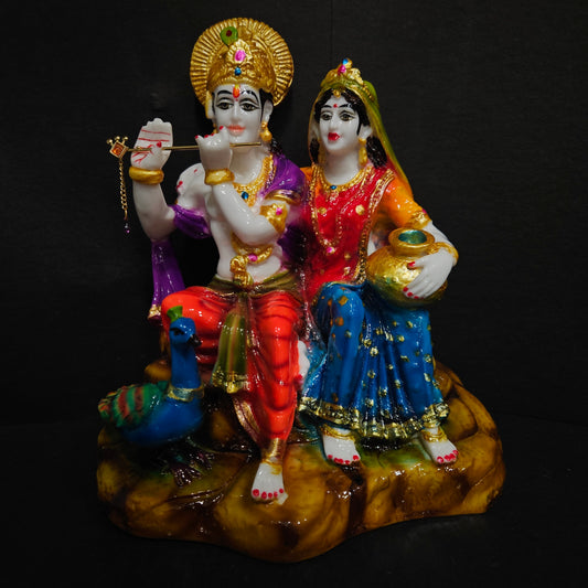 Lord radha Krishna sitting on stone with peacock playing flute statue idol for Home pooja