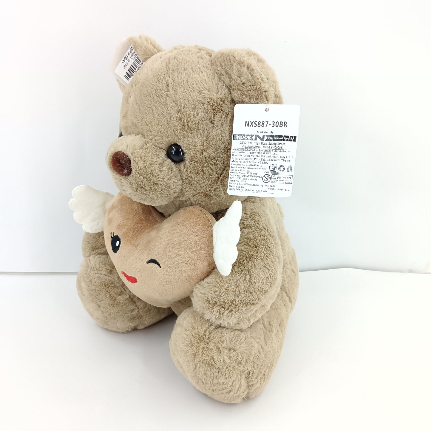 Brown teddy bear soft toy