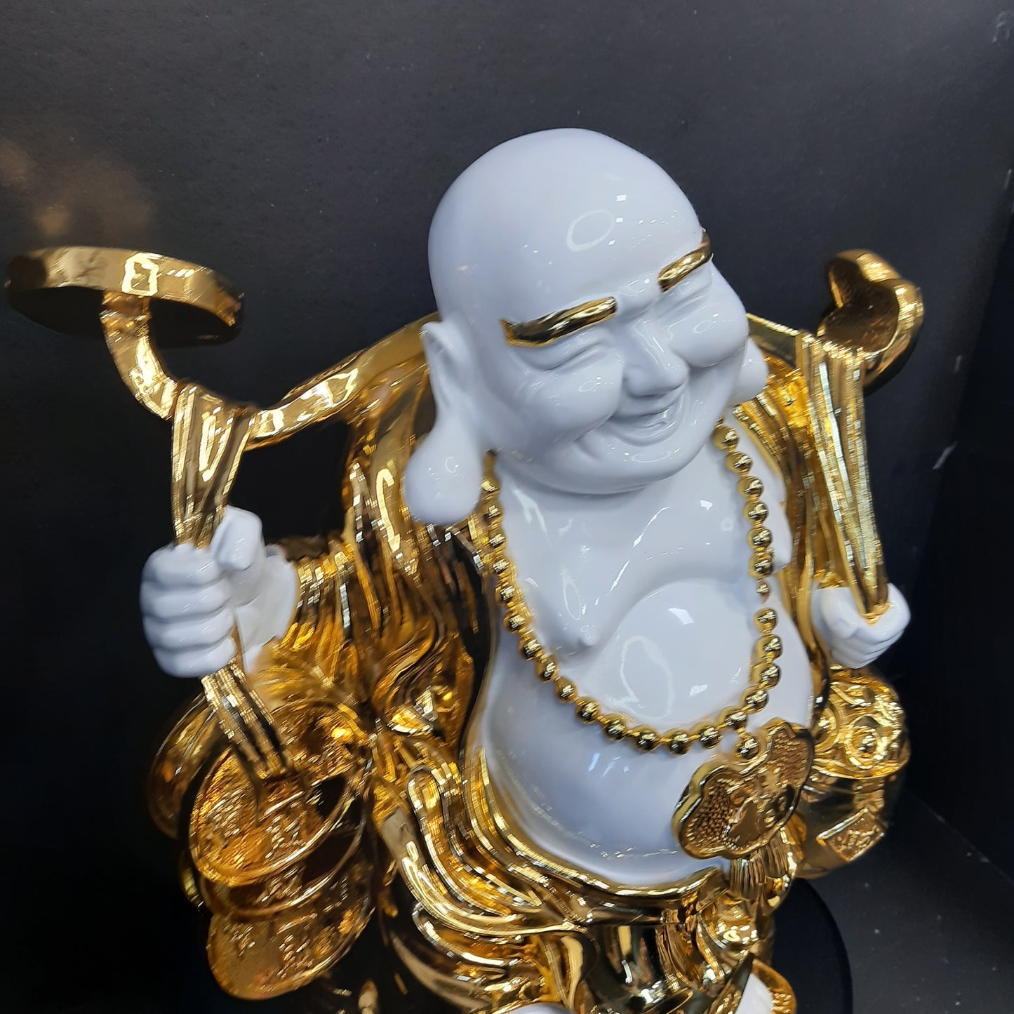 Gold and white laughing Buddha