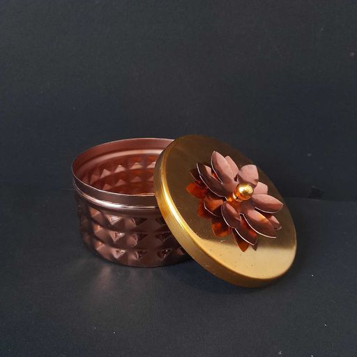 copper coated storage container with flower design