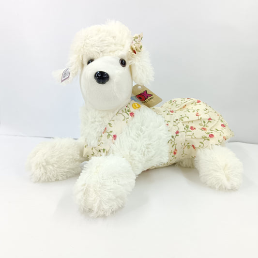 Girl dressed dog soft toy