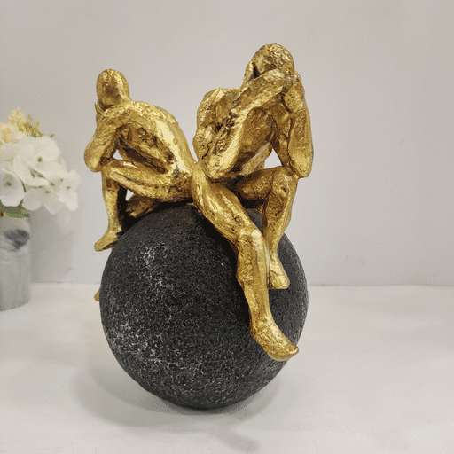 Wise man sitting on sphere Showpiece for home decoration