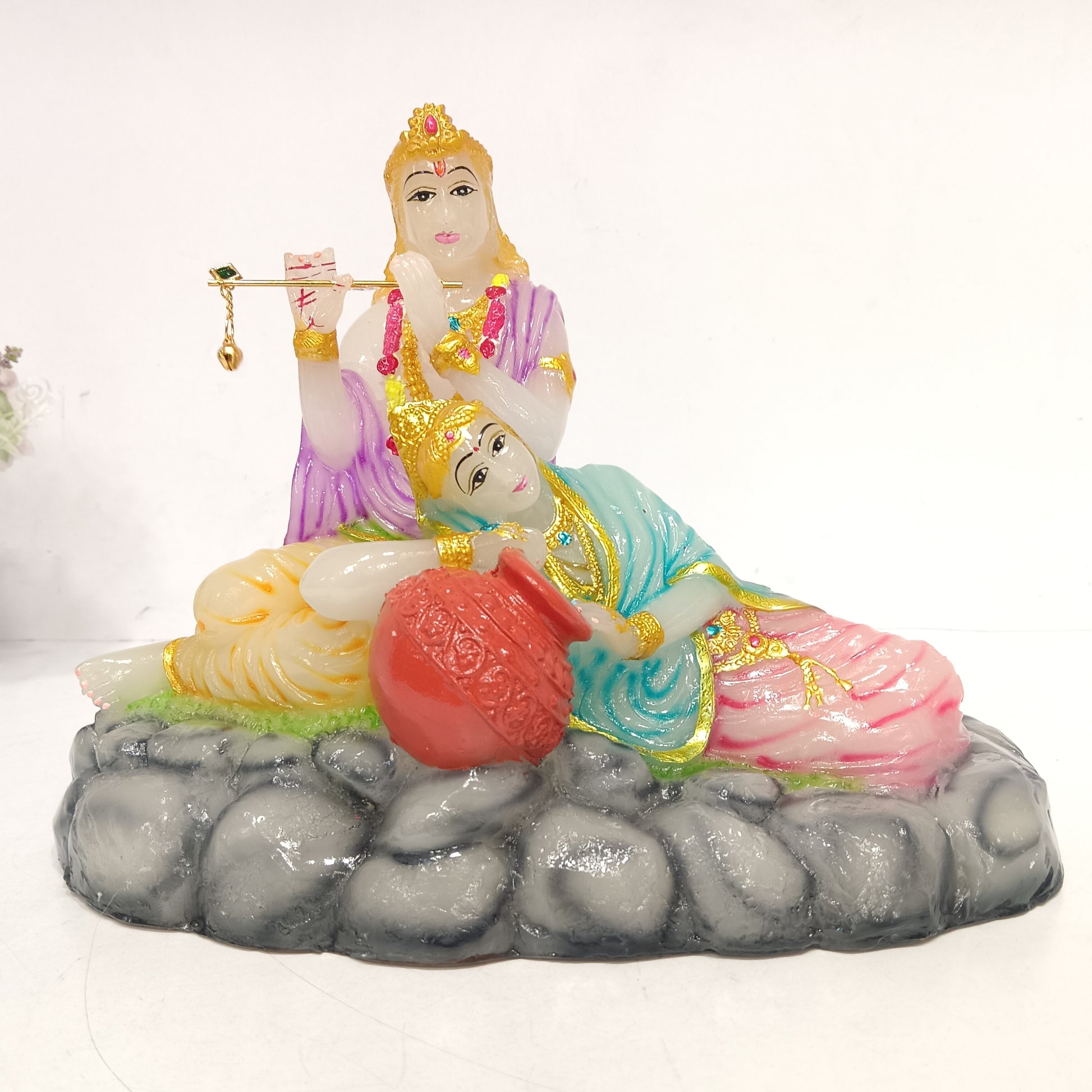 Radha Krishna setting on stones idol