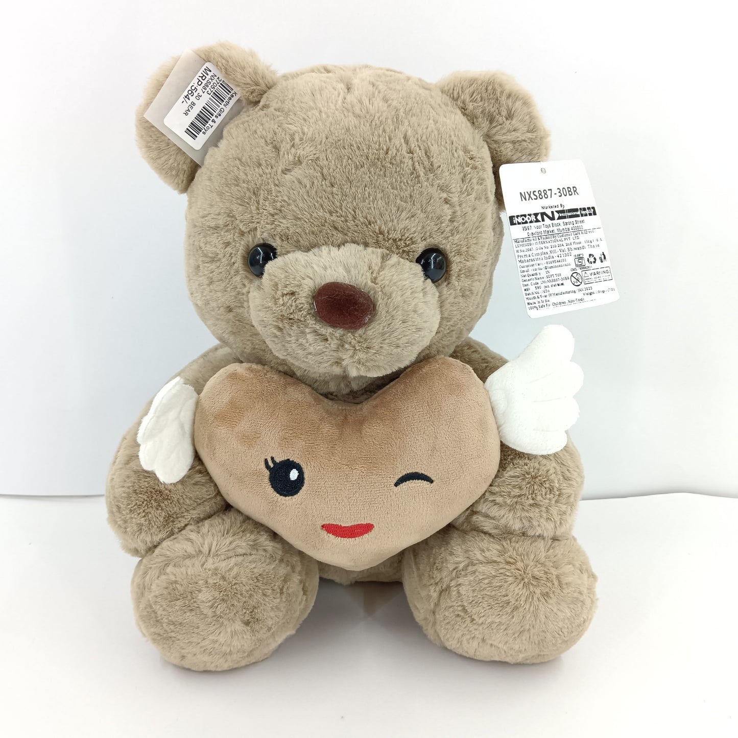 Brown teddy bear soft toy