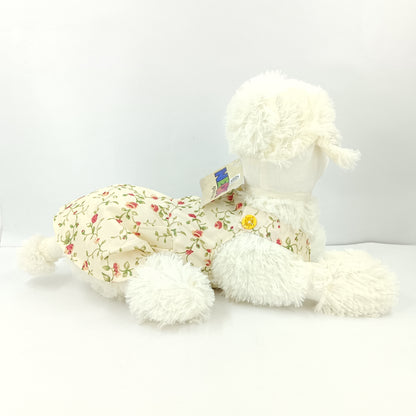 Girl dressed dog soft toy