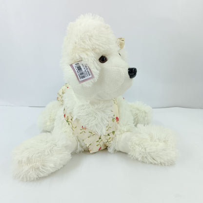 Girl dressed dog soft toy