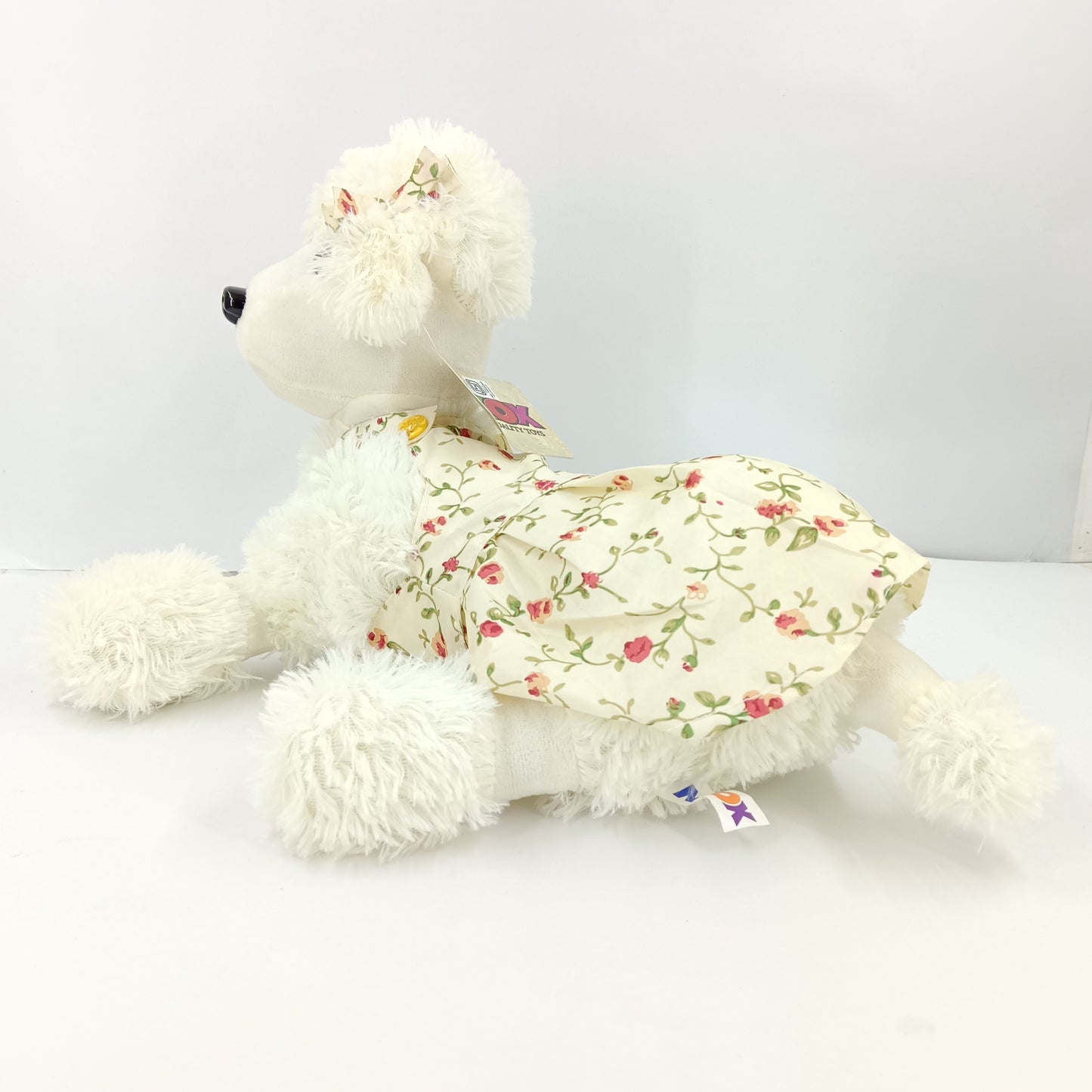 Girl dressed dog soft toy