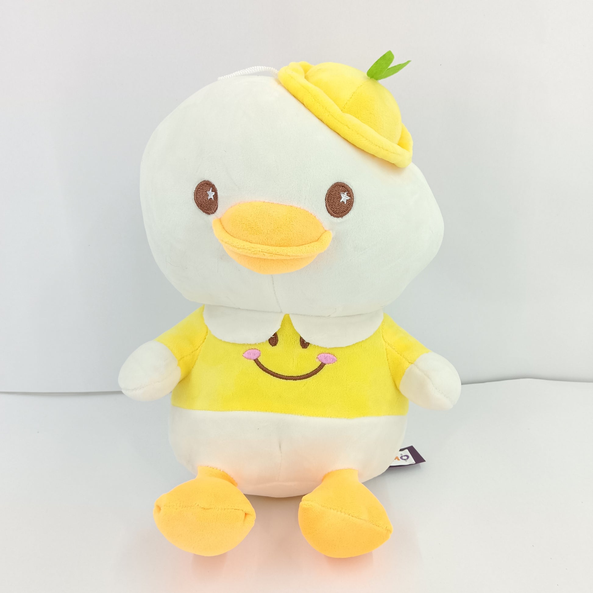 Cute duck in smiley face uniform soft toy